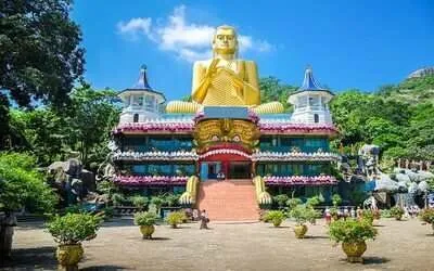 Golden Buddha statue and cave temple murals at Dambulla